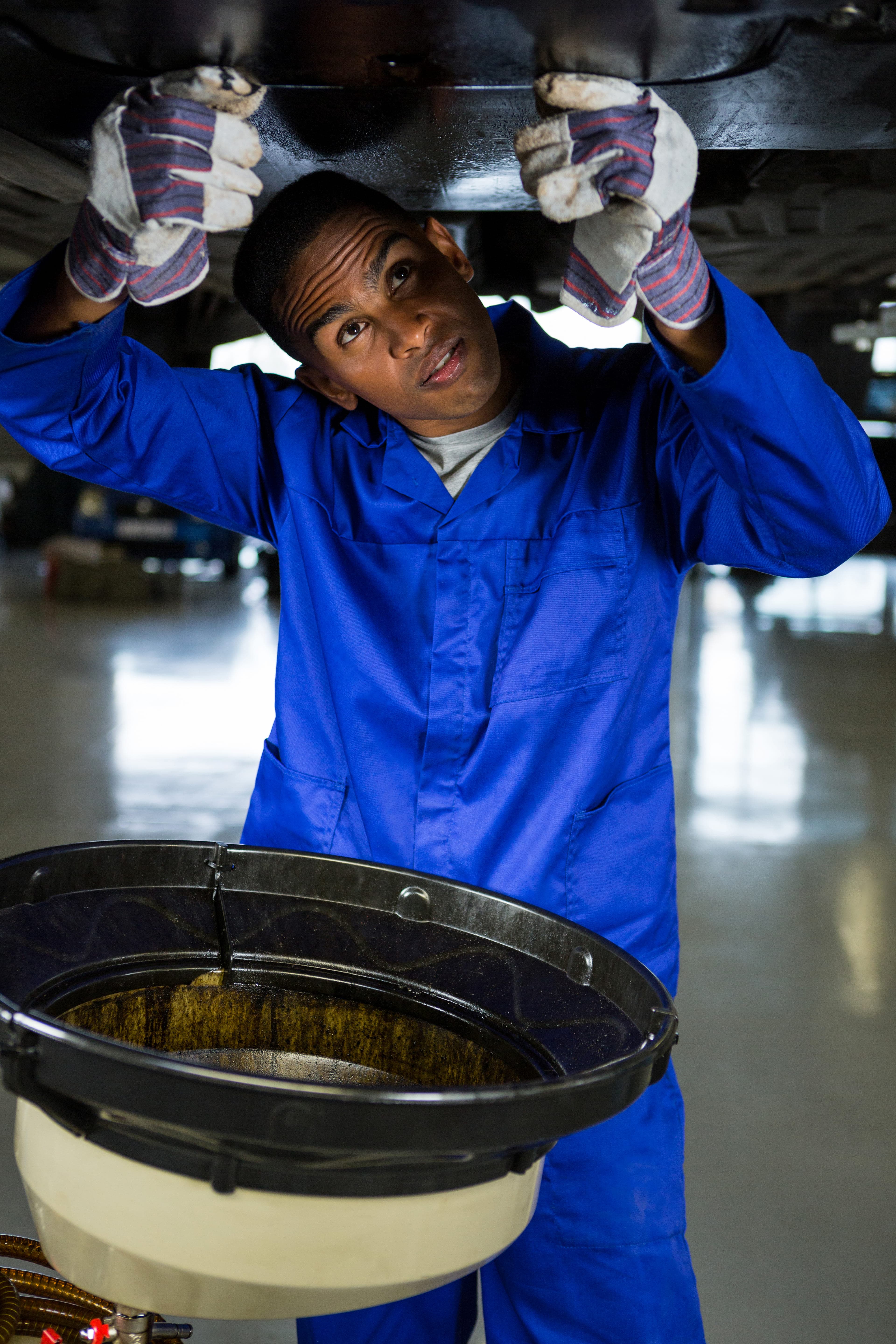 Mechanic servicing a vehicle
